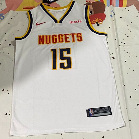 Denver Nuggets Player Jokić Wearing A White Jersey With The Number 15 - Picture 1 of 7